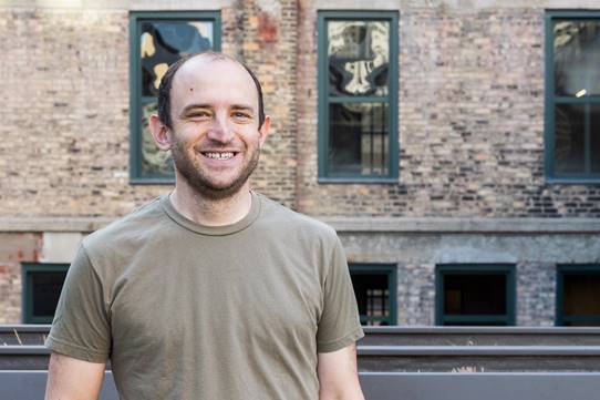 Picture of Ilya Sheyman in front of a building